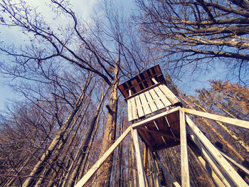 Low angle view of building and trees against sky