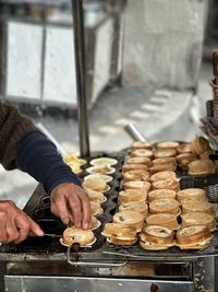 Midsection of man preparing food