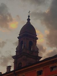 Low angle view of built structure against cloudy sky