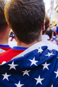 Rear view of man with american flag at event