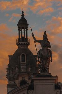 Low angle view of statue against sky during sunset