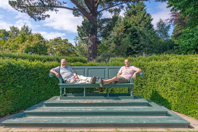 People sitting on bench in park