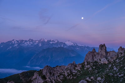 Scenic view of mountains against sky at night