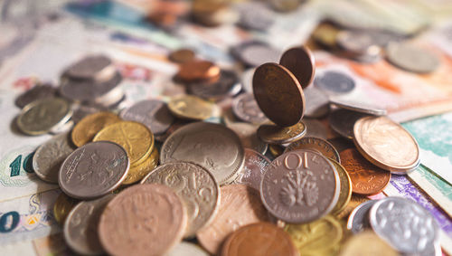 Close-up of coins on table