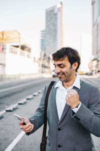 Man using mobile phone in city