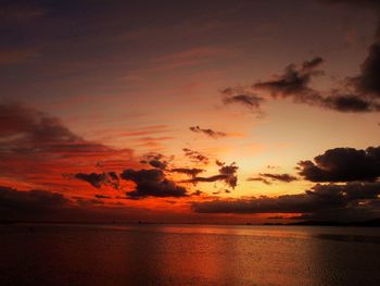 Scenic view of sea against orange sky