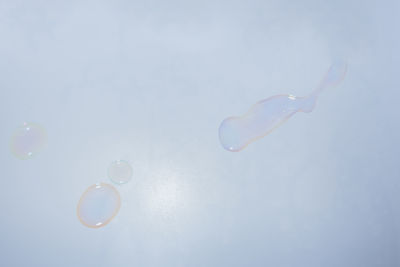 Close-up of water on white table