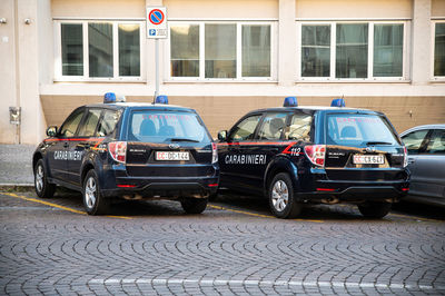 Cars parked on street in city