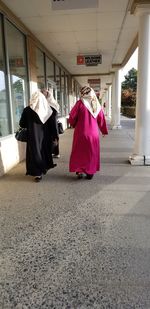 Rear view of couple in corridor