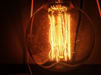 Close-up of illuminated light bulb