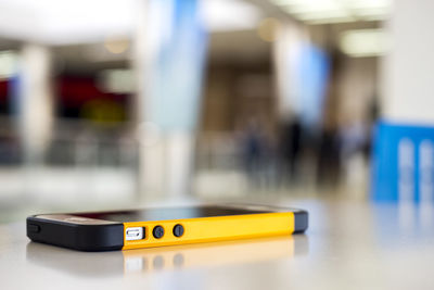 Close-up of mobile phone on table