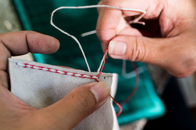 Close-up of hands sewing
