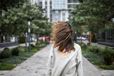 Windy weather, hairs close woman's face