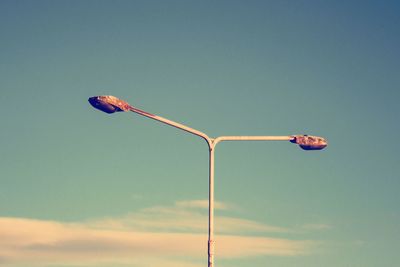 Low angle view of wind turbine against sky