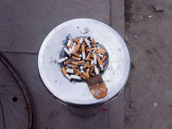 Directly above shot of cigarette butts in ashtray