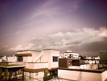 Buildings in city against sky