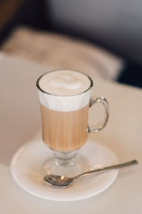 Close-up of coffee cup on table