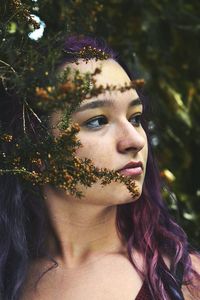 Close-up of young woman with eyes closed