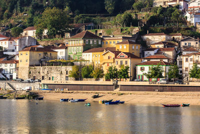 Houses by river