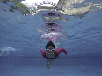 Woman swimming in sea