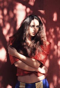 Portrait of a beautiful young woman standing outdoors