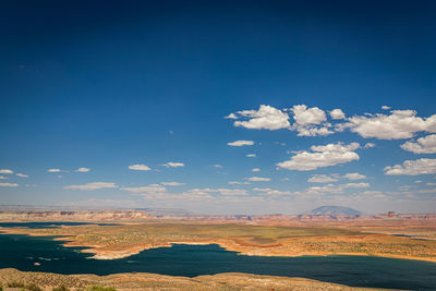 Scenic view of landscape against blue sky