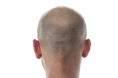 Close-up portrait of man against white background