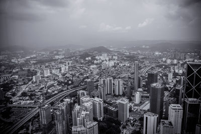 Aerial view of cityscape against sky