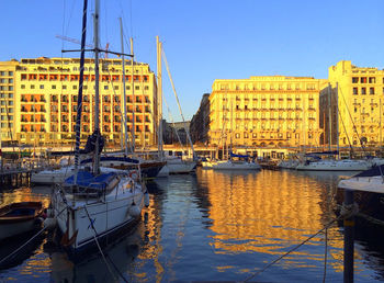 Boats moored in canal