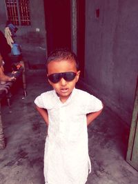 Portrait of boy standing outdoors