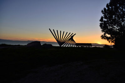 Scenic view of silhouette land against sky during sunset