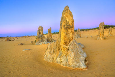 Panoramic view of rock formation in desert against sky