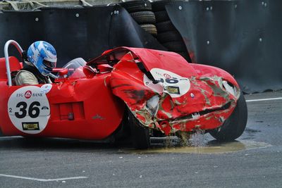 Close-up of damaged car on road