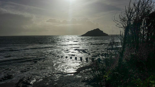 Sun shining over sea