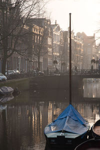 Boats moored in city