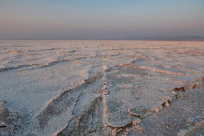 Aerial view of desert against sky during sunset