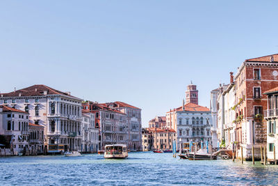 View of buildings in city against clear sky