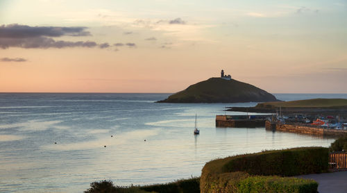 Scenic view of sea against sky at sunset