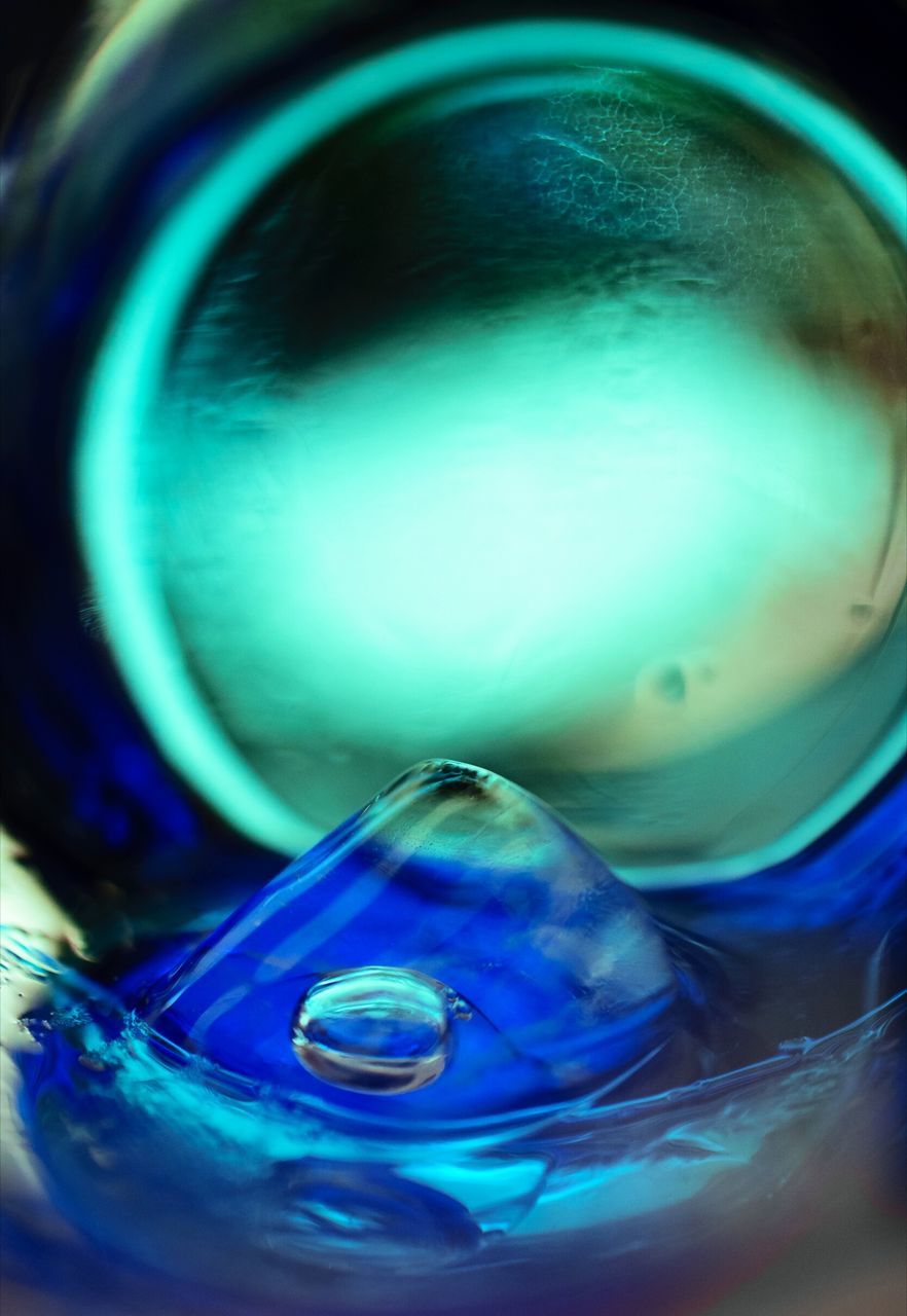 close-up, selective focus, no people, still life, indoors, drink, blue, water, glass - material, container, refreshment, high angle view, shape, bubble, glass, bottle, food and drink, sphere, nature