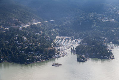 High angle view of buildings by sea
