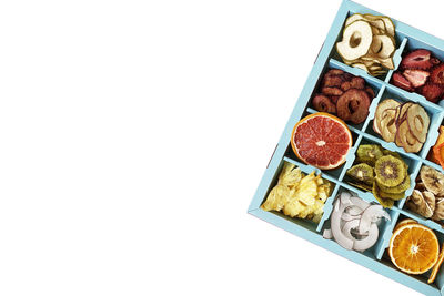 High angle view of fruits against white background