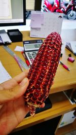 Close-up of hand holding ice cream