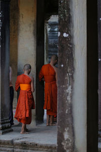 Monks walking in old temple