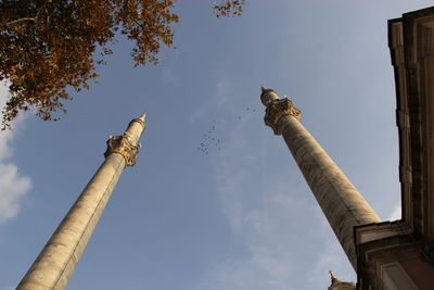 Twin  mosque minarets reaching  to the sky 