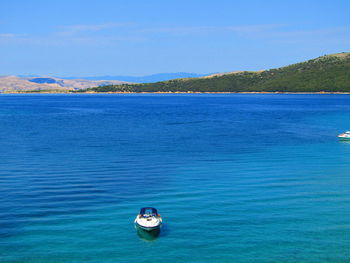 Boat in sea against sky