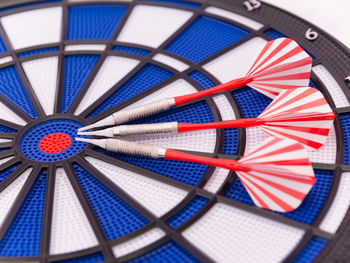 Close-up of darts on dartboard