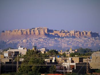 High angle view of buildings in city against clear sky