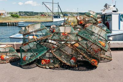 Crab cage stack on pier at lake