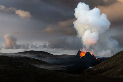 Smoke emitting from volcanic mountain