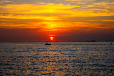 Sunset over the sea and a boat